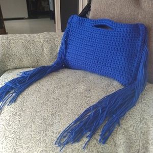 Handmade crochet bag with fringe down the sides